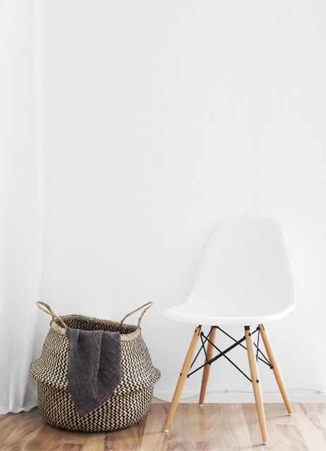 Minimalist Interior with a Chair and a Hamper